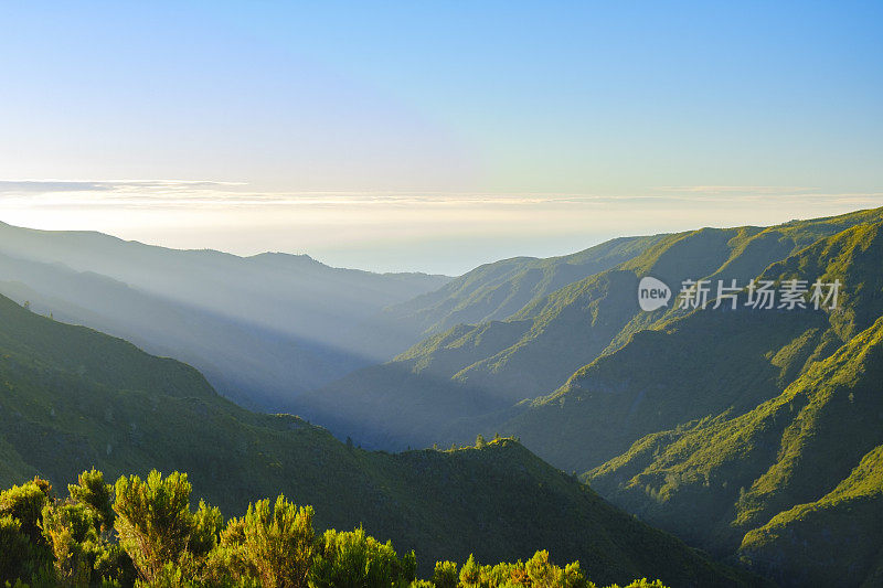 Clouds over the mountains near Rabaçal on Madeira island during sunset